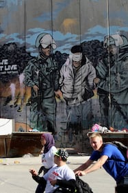 La Palestina corre contro il muro di separazione 1