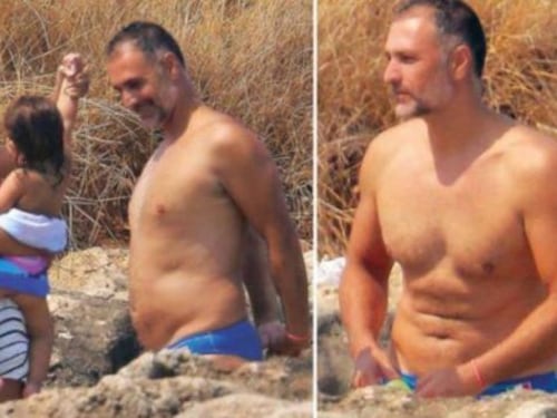 Raoul Bova (irriconoscibile e appesantito) in vacanza con la moglie