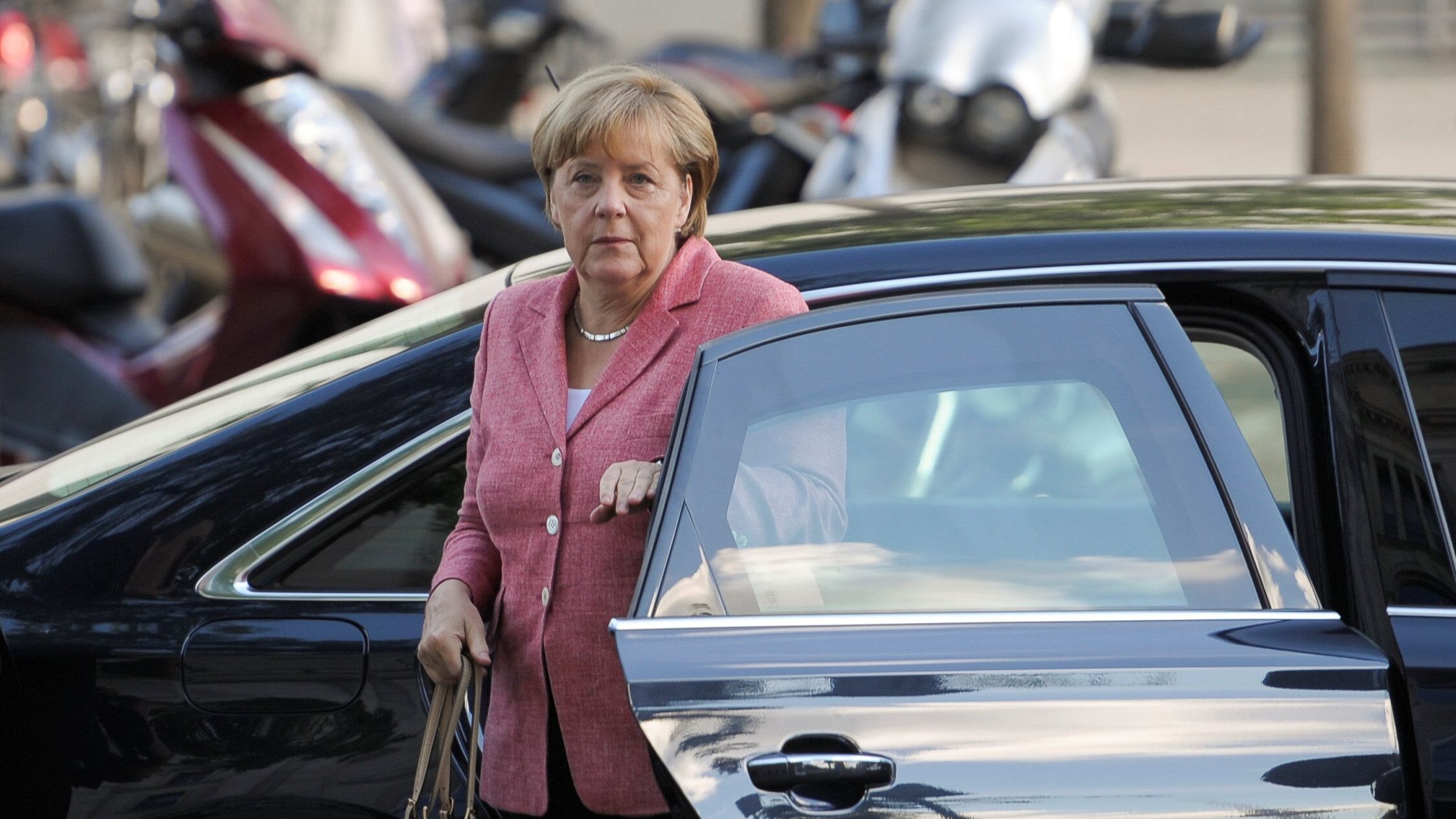 Nasce l'asse tra Draghi e Merkel contro Trump
