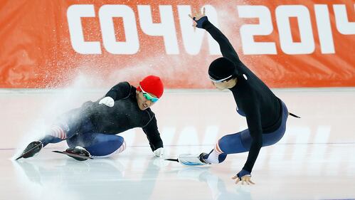 Kim Jun-Ho (L) of South Korea crashes during practice