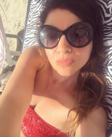 Cristina D'Avena: fisico scolpito in costume 9