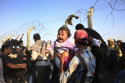 I profughi sfondano il confine tra Turchia e Siria 5
