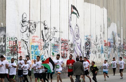 La Palestina corre contro il muro di separazione 6