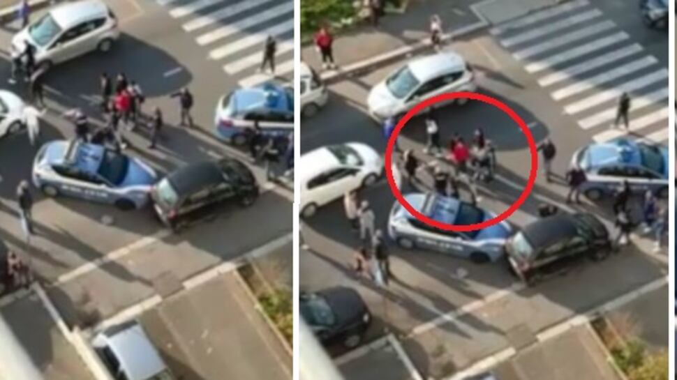Roma, allarme sicurezza. Polizia accerchiata, l'agente punta la pistola