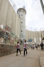 La Palestina corre contro il muro di separazione 16